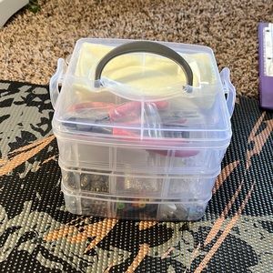 Bracelet making supplies in a 3 tier craft carry case.
